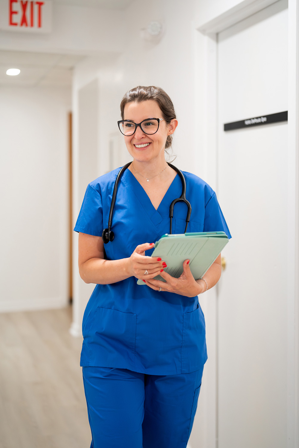 Doctor walking down hall
